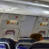 Пассажир толкнул стюардессу и попытался открыть дверь самолета во время полета